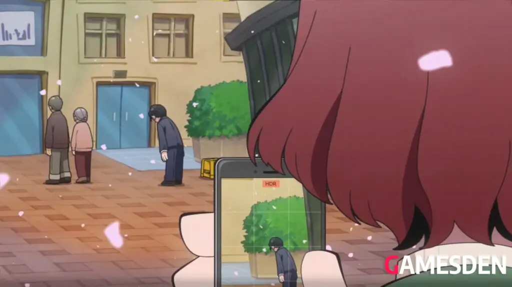 Natsuhara taking a picture of Toshiro helping people.